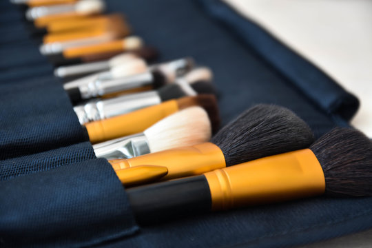 Professional make-up, brushes and accessories on the table. Equipment of facial make over art.  