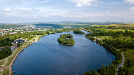 Fototapeta premium Aerial view of Bryn Bach park and lake in Tredegar, South Wales