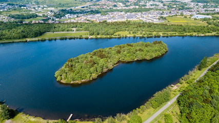 Fototapeta premium Aerial view of Bryn Bach park and lake in Tredegar, South Wales