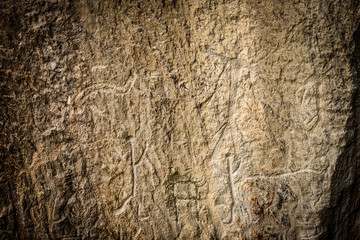 Ancient rock carvings petroglyphs of people with boat in Gobustan National park. Exposition of...