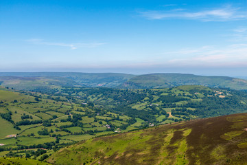 Fototapeta na wymiar Aerial view of green farmland and fields in the rural Welsh countryside