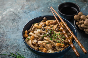 noodles with chicken and shimeji mushrooms in blue  bowl