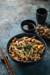 noodles with chicken and shimeji mushrooms in blue  bowl
