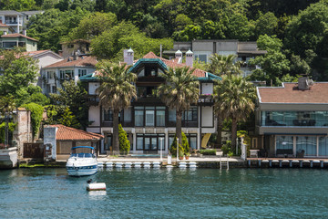 Beautiful View of Bosphorus Coastline in Istanbul with Exquisite wooden Houses and Boat