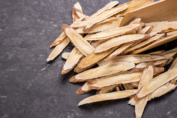 Chinese herbal medicines -- Astragalus on stone background, blank for text, copy space