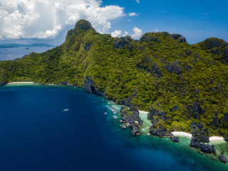 Aerial view of a beautiful tropical island with cliffs and mountains in the Bacuit Archipelago, Philippines