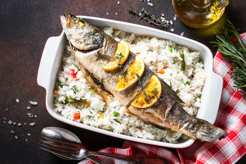Fish seabass baked with rice and vegetables.