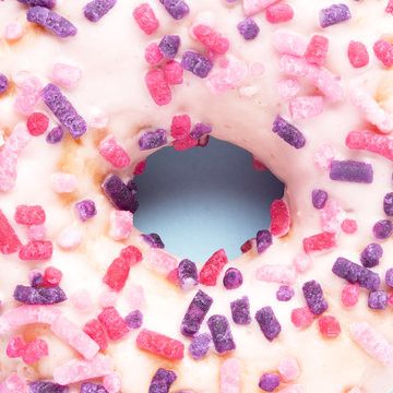 Black hole / Creative close up photo of donut on blue background.