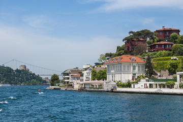 Obraz premium Beautiful View of Bosphorus Coastline in Istanbul with Exquisite wooden Houses and Boat