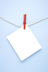 To do list / Creative concept photo of list with pin clothes peg on blue background.