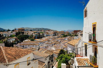 View from hill on traditional houses and historic city center in Ronda, Andalusia, Spain.