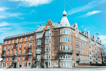 Fototapeta premium urban scene with beautiful architecture of copenhagen and cloudy sky, denmark