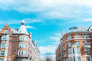 urban scene with beautiful architecture of copenhagen and cloudy sky, denmark