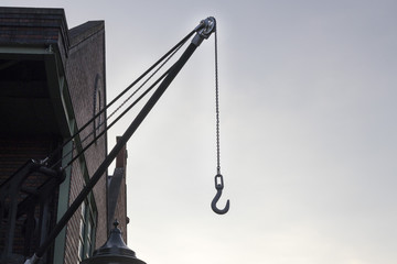 Outdoor crane with a hook on the end of the chain