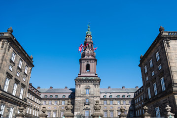 urban scene with historical Christiansborg Palace in copenhagen, denmark