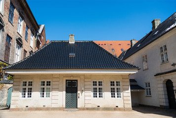 urban scene with buildings and empty street in copenhagen, denmark