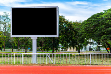 Digital blank scoreboard at football stadium with running track in sport stadium in outdoor ,Advertising Billboard LED, Empty black screen digital.