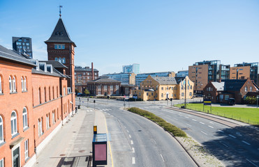 high angle view of empty road, bus stop and modern buildings in copenhagen, denmark