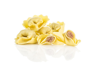 Raw tortellini Italian pasta stuffed with meat isolated on white background. - obrazy, fototapety, plakaty