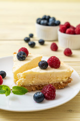 Homemade cheesecake with raspberries and blueberries