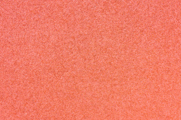 Running track red ground rubber cover texture background.