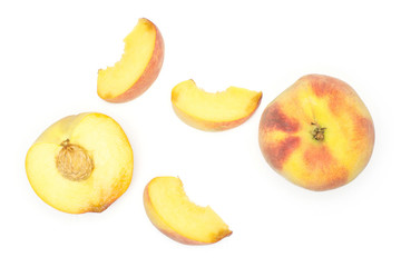 One yellow peach, a section half and three slices, flatlay, isolated on white background.