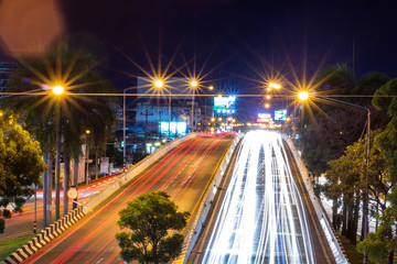 Beautiful scene of The color of Night traffic lights on the Road in Phitsanulok City, Thailand. June 1, 2018