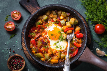 Fried egg with vegetables. 