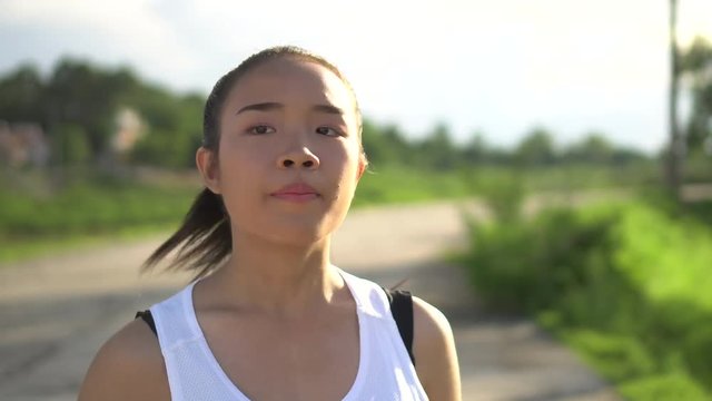 Young beautiful asian woman Jogging in the park