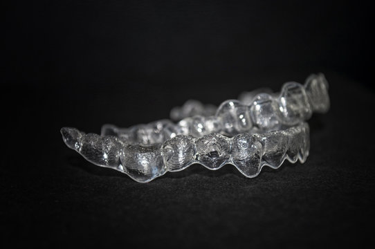 Invisalign. Invisible mobile braces aligner for orthodontic appliance. Dental correction. Dental orthodontic silicone trainer printed in 3d. Invisible braces aligner.