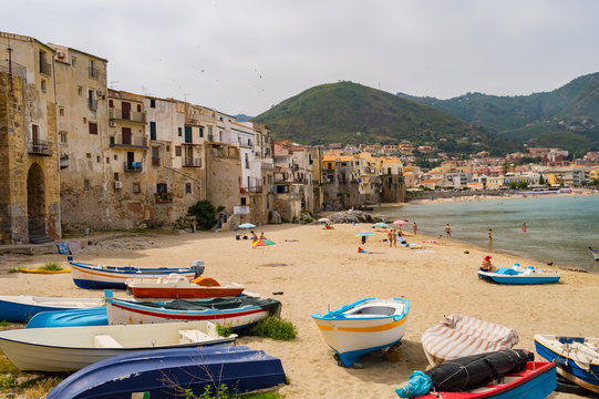 View of the boat, the old town and the beach
