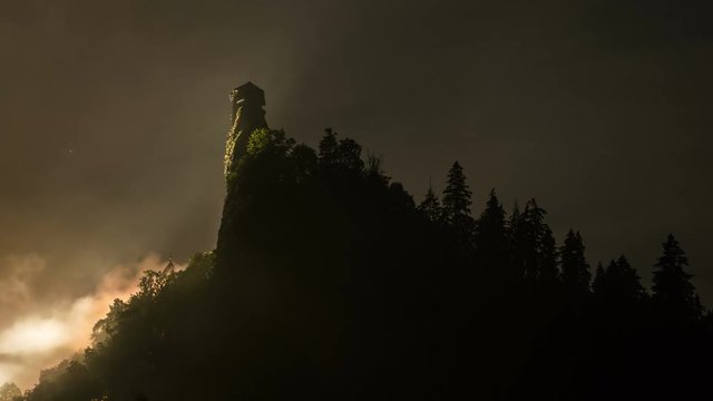 Mysterious fog over dracula castle tower