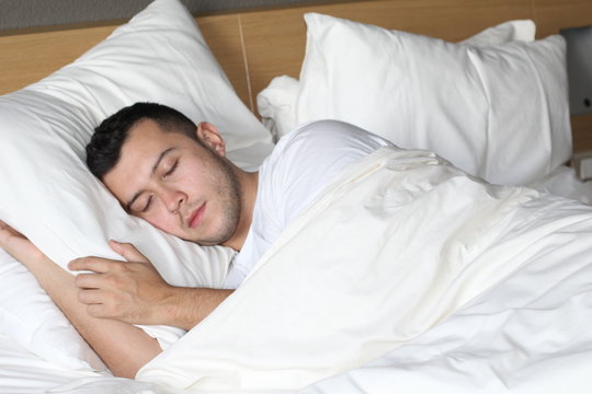 Relaxed ethnic male sleeping like a baby