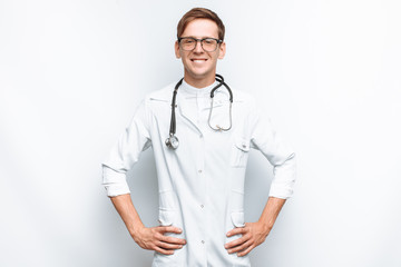 Portrait of a young doctor on a white background, Intern in the Studio, with a stethoscope on the neck