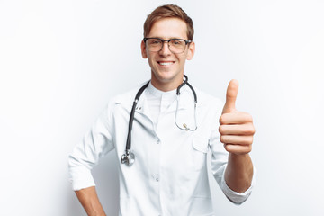 Doctor shows thumb up, success of young student, on white background