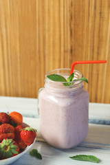 Strawberry yogurt in a glass jar