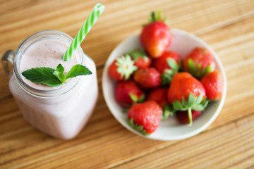 Healthy milk cocktail with strawberries