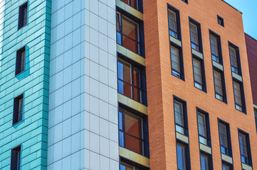 Fototapeta premium Fragment of one of the serial high-rise apartment building