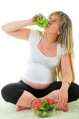 pregnant woman eating vegetables