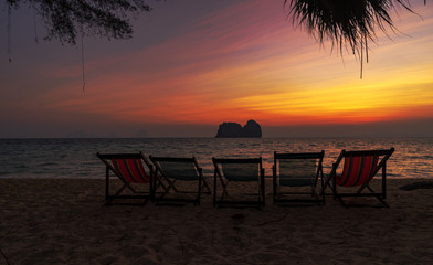 five beach chair on sunset sky twilight