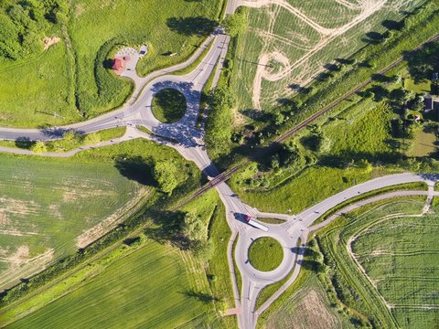 Aerial view of roundabout circles, railroad line and bike lanes, Mazury, Poland