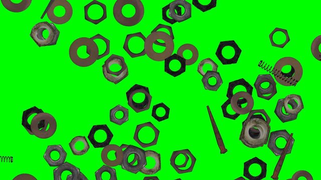 Metal nuts, springs, nails, washers, fall on green screen. Slow motion 