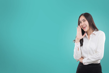Young beautiful woman shouting something. Isolated on green background