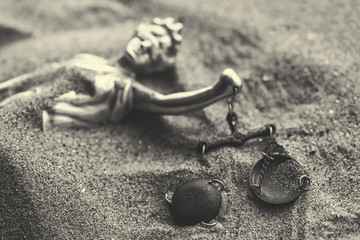 Statue of lady Justice buried in sand