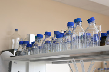 Varieties size of laboratory glass bottle on shelf