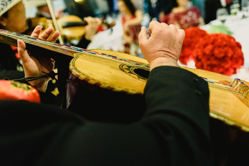 Mexican musician with his trumpet and guitars