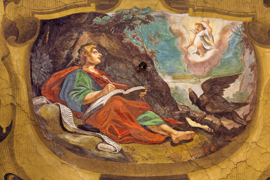 REGGIO EMILIA, ITALY - APRIL 13, 2018: The fresco of Vision of St. John the Evangelist on the Patmos island in church Chiesa di San Giovanni Evangelista by  Tommaso Sandrini (1613).