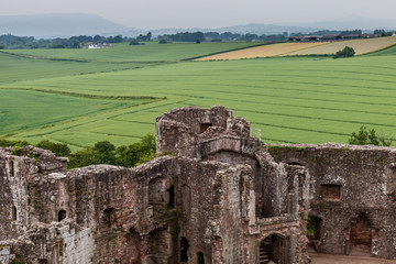 View from the ruins of an ancient medieval castle showing cultivated fields and farmland (Raglan Castle)