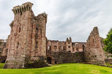 Fototapeta na wymiar Walls and towers of a ruined ancient medieval castle (Raglan Castle)