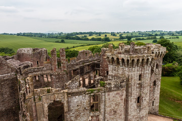 Obraz premium Ramparts and towers of a ruined medieval castle (Raglan Castle, Wales)